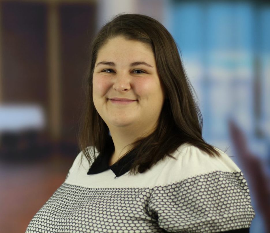 Brown-haired female in a black and white shirt